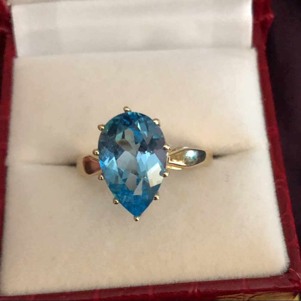 Blue topaz yellow gold ring